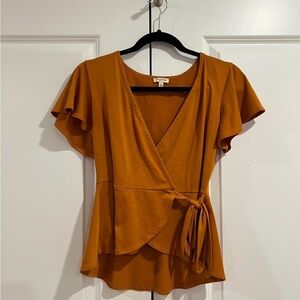 flowy burnt orange blouse
